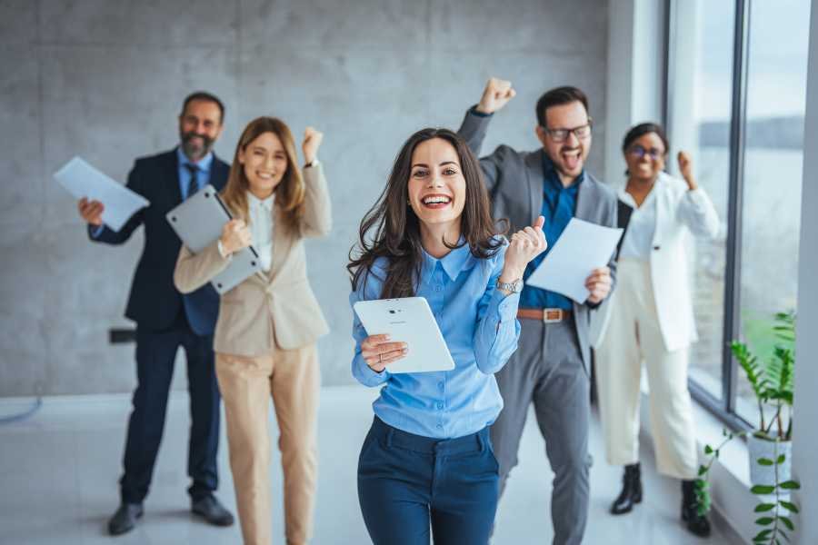 People reviewing documents after a loan closing insurance problem is addressed