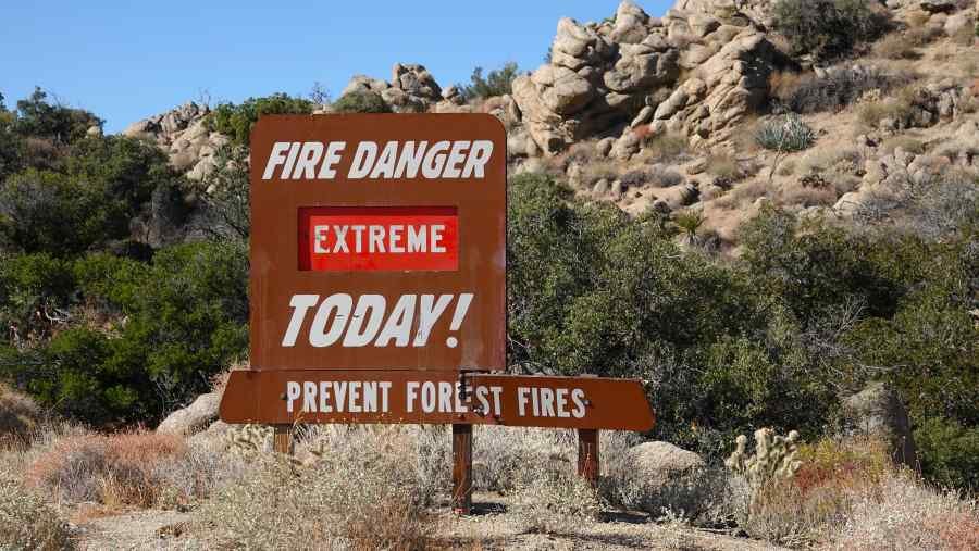 Wildfire area near homes representing homeowners insurance problems before closing